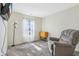 Comfortable living room with a recliner and a window, perfect for relaxation at 1156 E Mill Run Blvd, Greenfield, IN 46140