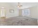 Spacious living room with neutral paint, plush carpeting, ceiling fan, and view to hallway at 1156 E Mill Run Blvd, Greenfield, IN 46140