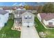 Aerial view of home showing landscaping, mature trees, and surrounding neighborhood at 11849 Wapiti Way, Noblesville, IN 46060