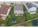 A spacious backyard features a patio set, green grass and play equipment for outdoor enjoyment at 11849 Wapiti Way, Noblesville, IN 46060