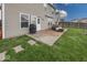 Backyard with a patio area, a well maintained lawn, and exterior of home at 11849 Wapiti Way, Noblesville, IN 46060