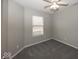 Bedroom featuring carpet, ceiling fan, a window with blinds, and neutral paint at 11849 Wapiti Way, Noblesville, IN 46060