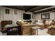 Finished basement area featuring a large sofa, TV, and arcade game at 11925 Piney Glade Rd, Noblesville, IN 46060