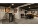 Basement with a bar area, comfortable seating, and entertainment options at 11925 Piney Glade Rd, Noblesville, IN 46060