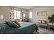 Comfortable bedroom with lots of natural light, neutral walls, and a cozy bench at 11925 Piney Glade Rd, Noblesville, IN 46060