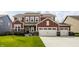 Beautiful two-story home with a well-manicured lawn and a spacious two-car garage, creating curb appeal at 11925 Piney Glade Rd, Noblesville, IN 46060