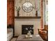 Elegant fireplace with a decorative mantel, complemented by stylish accents and comfortable seating at 11925 Piney Glade Rd, Noblesville, IN 46060