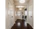 Bright hallway featuring hardwood floors and views into a naturally lit office at 11925 Piney Glade Rd, Noblesville, IN 46060