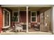 Relaxing covered patio with comfortable seating and stylish decor, perfect for entertaining at 11925 Piney Glade Rd, Noblesville, IN 46060