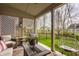 Covered patio featuring comfortable seating and views of the well-manicured backyard at 11925 Piney Glade Rd, Noblesville, IN 46060