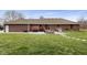 Beautiful exterior view of brick home in a landscaped backyard, with patio at 12129 N Cedarview Dr, Mooresville, IN 46158