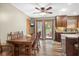 Charming dining area with wooden table and chairs, adjacent to a patio with outdoor seating at 12129 N Cedarview Dr, Mooresville, IN 46158