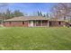 Lovely brick home featuring a welcoming front porch and well-maintained lawn at 12129 N Cedarview Dr, Mooresville, IN 46158