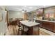 Well-lit kitchen boasts an island with bar stool seating and hardwood floors at 12129 N Cedarview Dr, Mooresville, IN 46158
