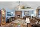 Bright living room showcases a fireplace, hardwood floors, and comfortable furnishings at 12129 N Cedarview Dr, Mooresville, IN 46158