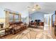 Open living room featuring a plush sofa, hardwood floors, and natural light at 12129 N Cedarview Dr, Mooresville, IN 46158