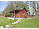 A backyard outbuilding offers additional storage, with an adjacent garden at 12129 N Cedarview Dr, Mooresville, IN 46158