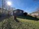 The backyard is spacious with trees and a partially shady area at 1246 Mcdougal St, Indianapolis, IN 46203