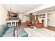 The finished basement boasts a stylish bar area, cozy seating, and updated flooring at 12569 Branford St, Carmel, IN 46032