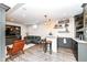 Finished basement area including bar with stools, an entertainment center and living area at 12569 Branford St, Carmel, IN 46032