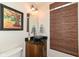 Stylish half bathroom featuring a vessel sink, decorative mirror, and bamboo blinds at 12569 Branford St, Carmel, IN 46032