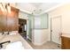 Bathroom featuring a glass corner shower, dual sinks and marble counter top at 12569 Branford St, Carmel, IN 46032