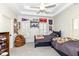 Comfortable bedroom featuring a tray ceiling, two twin beds, and sports memorabilia at 12569 Branford St, Carmel, IN 46032