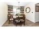 Charming dining room with rustic wood furniture and ample natural light at 12569 Branford St, Carmel, IN 46032