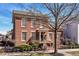 A classic brick home with white-trimmed windows and a garden at 12569 Branford St, Carmel, IN 46032