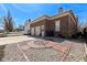A detached garage with brick accents, a driveway, and a circular landscaped garden at 12569 Branford St, Carmel, IN 46032