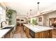 Modern kitchen with expansive island, chef-grade appliances, and open layout at 12569 Branford St, Carmel, IN 46032