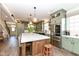 Well-equipped kitchen featuring a large island, stainless steel appliances, and custom cabinetry at 12569 Branford St, Carmel, IN 46032