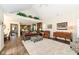 Bright living room with hardwood floors, ample seating, and access to the kitchen, perfect for entertaining at 12569 Branford St, Carmel, IN 46032