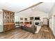 Bright living room featuring high ceilings, fireplace, built-ins, and ample seating at 12569 Branford St, Carmel, IN 46032