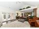 Open-concept living room with high ceilings and natural light, showcasing seamless flow to other spaces at 12569 Branford St, Carmel, IN 46032