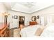 Spacious bedroom with natural light, open doorway to the kitchen, and wood furnishing at 12569 Branford St, Carmel, IN 46032