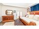 Comfortable bedroom featuring a large wooden bed, decorative pillows, and private outdoor access at 12569 Branford St, Carmel, IN 46032