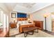Serene bedroom with a wooden bed frame, a soft rug, and plenty of dresser storage at 12569 Branford St, Carmel, IN 46032
