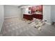 Finished basement with carpet and a kitchenette with cherry wood cabinets and an island at 13820 N Honey Creek Dr, Camby, IN 46113