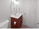 Bathroom with a vanity with cherry wood cabinets, toilet, and chrome lighting at 13820 N Honey Creek Dr, Camby, IN 46113