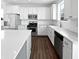 Modern kitchen featuring stainless steel appliances, white cabinets, and large island at 13820 N Honey Creek Dr, Camby, IN 46113