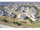 Aerial view of a neighborhood with homes featuring well-kept lawns and mature trees at 13947 Morningtide Cir, Fishers, IN 46038