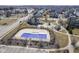 Aerial view of neighborhood pool with playground and walking paths at 13947 Morningtide Cir, Fishers, IN 46038