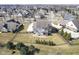 Aerial view of home with a well-maintained lawn and patio area at 13947 Morningtide Cir, Fishers, IN 46038