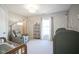 Bright Bedroom with wallpaper, a comfy recliner, and nature-themed decor at 13947 Morningtide Cir, Fishers, IN 46038