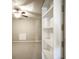 Bedroom view with ceiling fan, closet, and large mirror on the wall at 13947 Morningtide Cir, Fishers, IN 46038