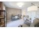 Cozy Bedroom with a cute crib, soft lighting, and nature-themed decor at 13947 Morningtide Cir, Fishers, IN 46038