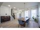 Elegant dining area featuring modern light fixtures and adjacent to a cozy piano space at 13947 Morningtide Cir, Fishers, IN 46038