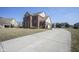 Classic brick home with a long driveway and well-maintained landscaping, exuding curb appeal at 13947 Morningtide Cir, Fishers, IN 46038
