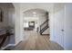 Inviting foyer with hardwood floors and an open layout leads to the living spaces at 13947 Morningtide Cir, Fishers, IN 46038